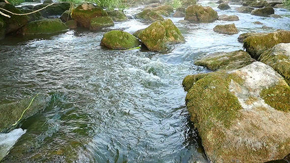 Fast Flowing River With Stones In The Water Slow Motion 6.jpg